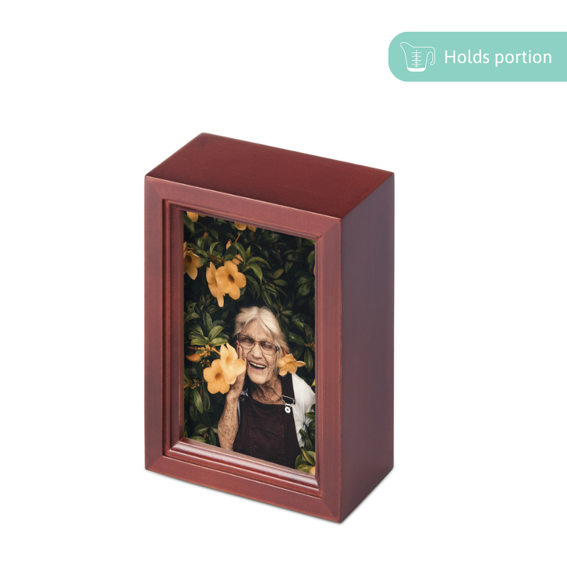 Catalpa wood small photo urn with vertical 6x4 photo display. Memorial urn holds a portion of ashes, secured with four screws.