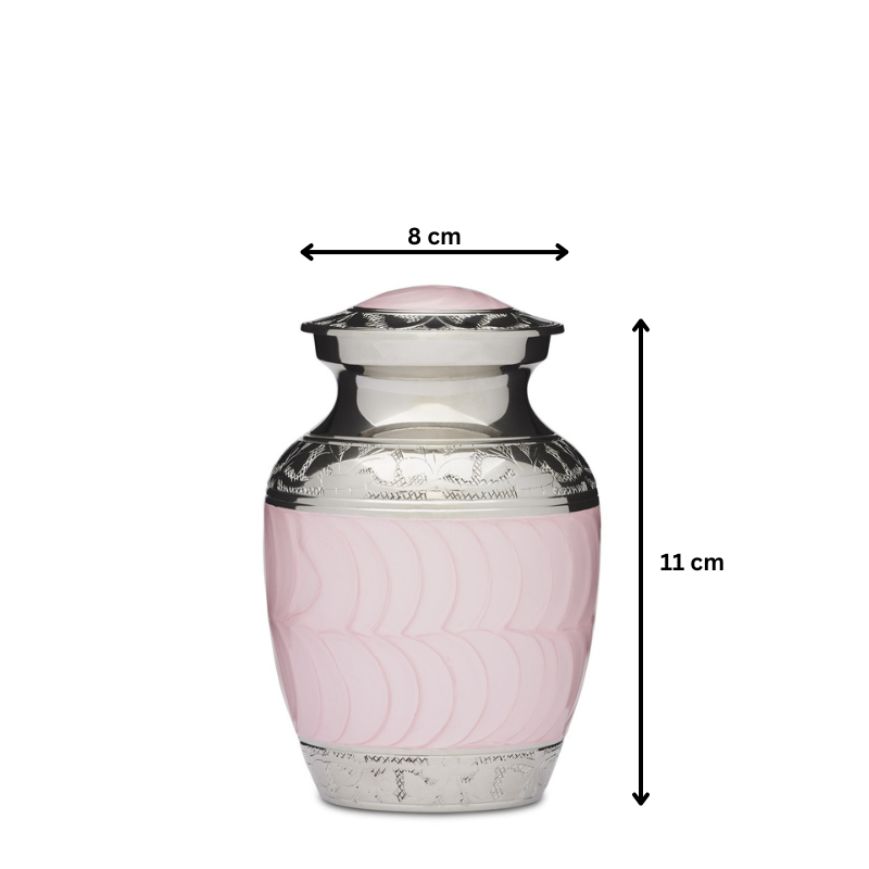 Small pink enamel and nickel urn measuring 11 cm tall and 8 cm wide. Solid brass construction with threaded lid and felted base for ashes.