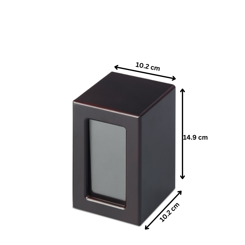 Medium Mahogany Photo Urn with timber veneer frame, 14.9cm height and 10.2cm width. Includes photo slot and ashes compartment.