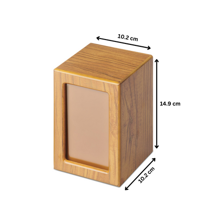 Medium Timber Veneer Photo Urn measuring 14.9cm x 10.2cm x 10.2cm. Features a photo slot and secure closure for partial ashes storage.