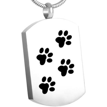Paw Print Tag - Custom Pet ID Pendant | Stainless Steel, Velvet Bag featuring black paw motifs on a polished silver surface. Ideal for pet memorial keepsakes.