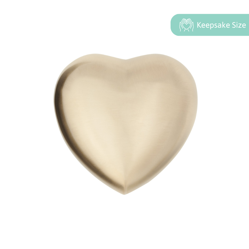Heart Keepsake Urn in brushed brass finish, ideal for ashes or mementos. Compact cremation urn with smooth metallic surface and velvet box included.