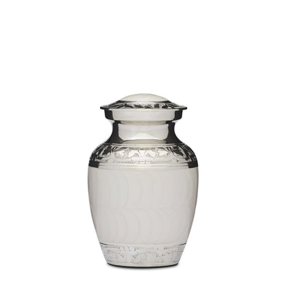 6" white enamel nickel urn in medium size, crafted from solid brass with elegant Fleur de Lis detailing and a secure threaded lid.