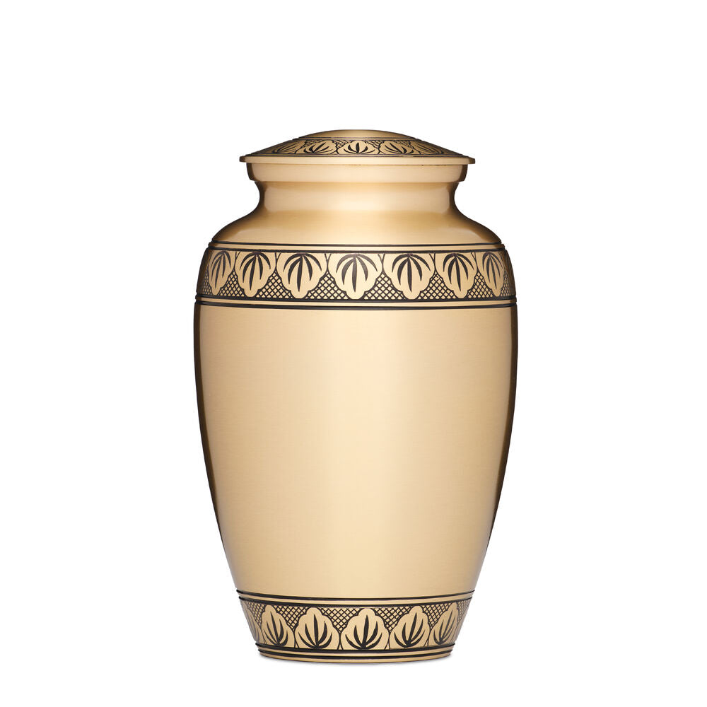 Athena Gold Colour Urn made of solid brass with a threaded lid and intricate black leaf design. Ideal for storing ashes securely and elegantly.