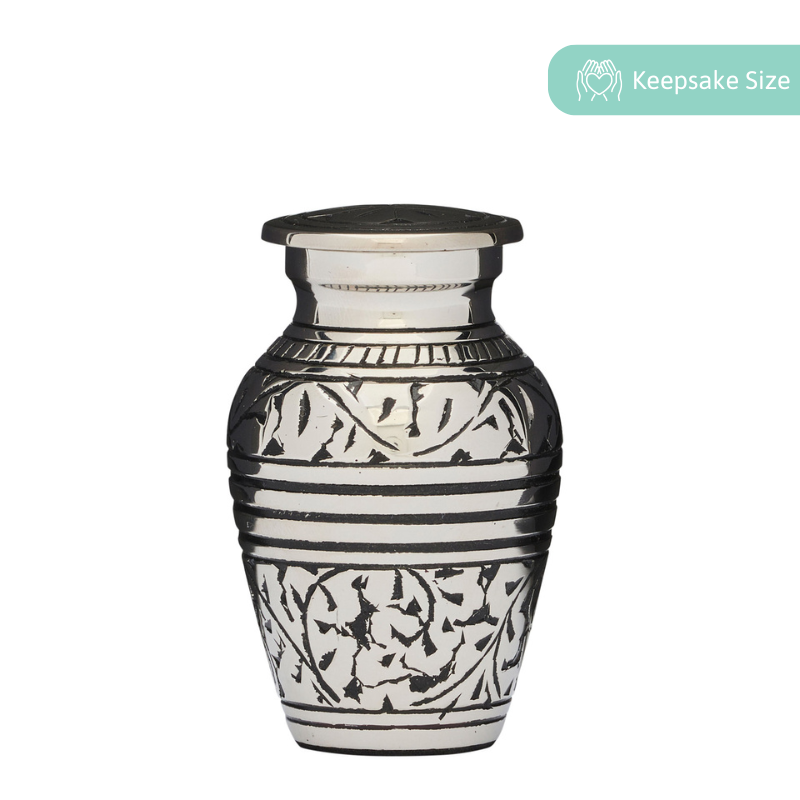Silver Acorn Keepsake Urn in solid brass with engraved acorn leaf design and threaded lid. Ideal for memorial ashes, includes a felted bottom.