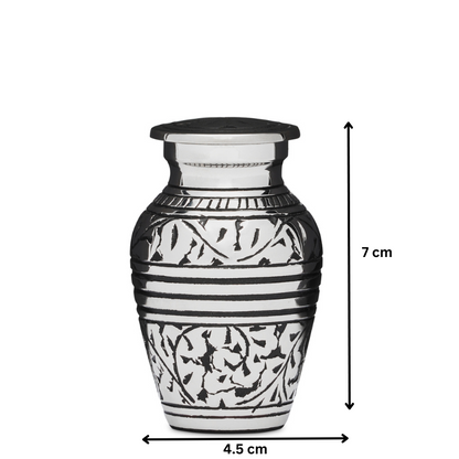 Silver Acorn Keepsake Urn measuring 7 cm tall and 4.5 cm wide, crafted from solid brass with intricate leaf engravings and secure sealing lid.