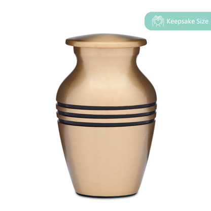 Classic Brass Keepsake Cremation Urn with matte finish and black accent bands, ideal for ashes or mementos. Includes a secure threaded lid.