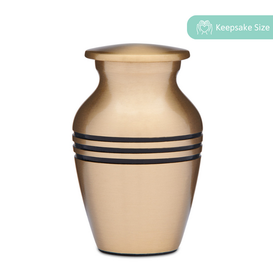 Classic Brass Keepsake Cremation Urn with matte finish and black accent bands, ideal for ashes or mementos. Includes a secure threaded lid.