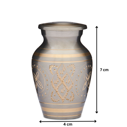 Gold Keepsake Urn - Brass Urn for Ashes measuring 7 cm tall and 4 cm wide. Features intricate gold detailing and a secure threaded lid.