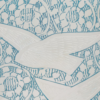 Close-up of Birds Returning Home Keepsake Urn showing intricate teal bird and floral engravings on polished solid brass surface.