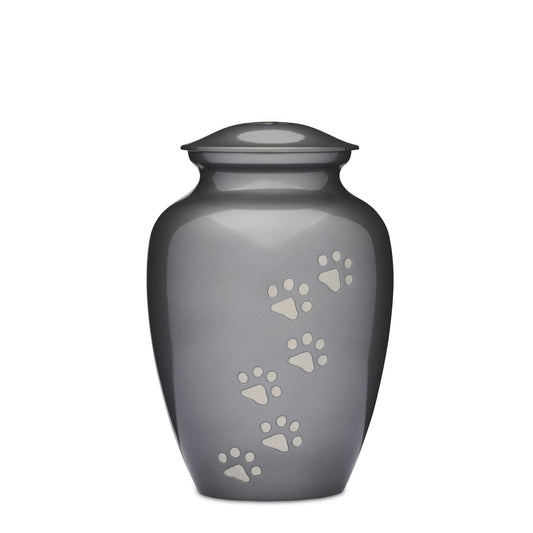 Grey Paws to Heaven Urn 8" features a sleek brass design with silver paw prints. A secure, elegant pet memorial urn to honor your beloved companion.