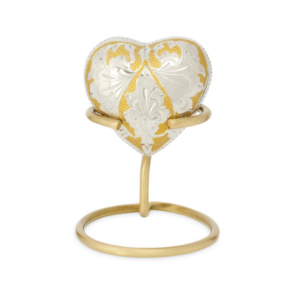 Dynasty Heart Keepsake Urn - Heart Keepsake Urn displayed on a gold stand, showcasing its elegant design and compact keepsake size.