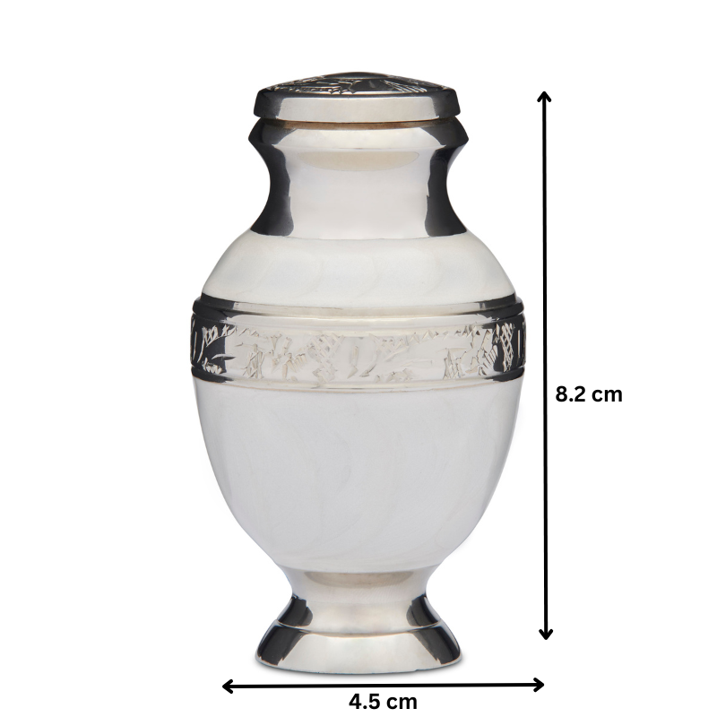 Elegant Keepsake White Urn measuring 8.2 cm tall and 4.5 cm wide, perfect for memorial use. Features intricate silver accents and a polished finish.