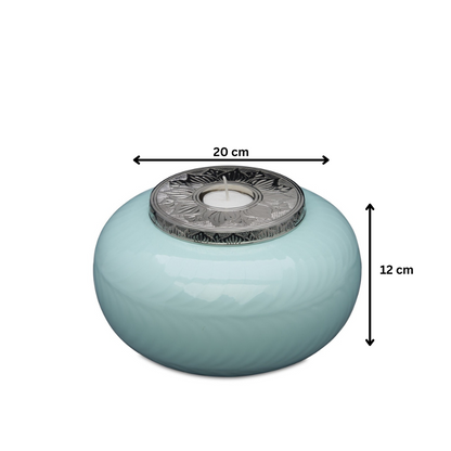 Medium Blue Silver Candle Urn measuring 20 cm wide and 12 cm tall, featuring a decorative silver top and smooth blue finish for memorial use.