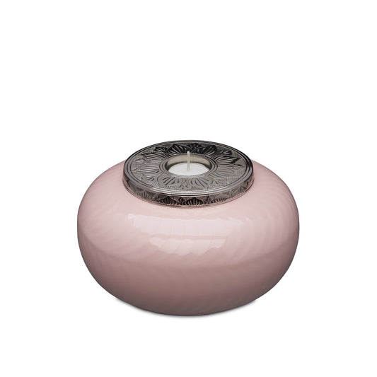 Medium candle urn in pink and silver with floral metal lid, ideal for elegant home decor and ambient lighting.