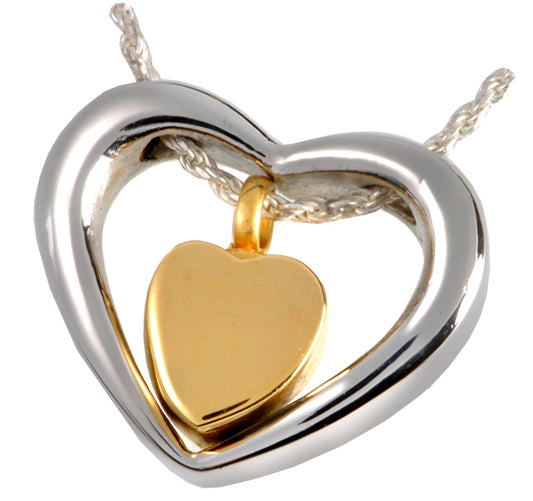 Heart Stainless Steel Pendant featuring a gold heart inside a silver heart frame. Elegant design with hypoallergenic, durable finish.
