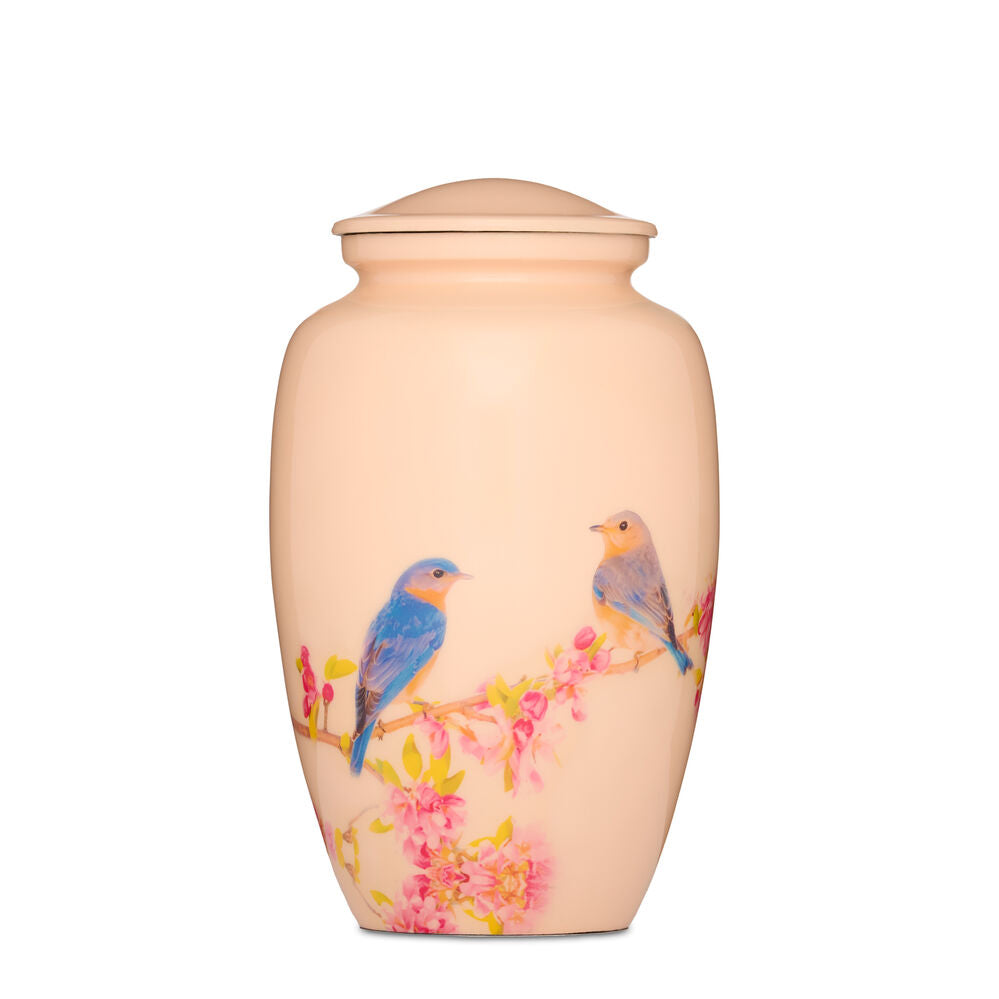 Birds Blossom Urn in durable ceramic featuring two colorful birds perched on pink cherry blossoms. Elegant garden decor for outdoor charm.