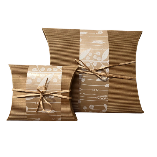 Eco-Friendly Burial Urn Large - Clementine in biodegradable cardboard with decorative wrap and raffia tie, ideal for natural soil burial.