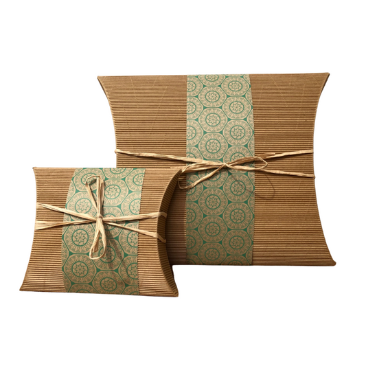 Eco-Friendly Bio Burial Urn Small Florence made from 100% recycled cardboard with green mandala wrap and natural twine tie.