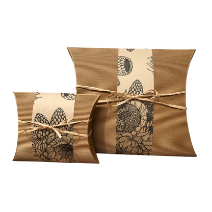 Bio Burial Urn Small - Protea | Recycled & Eco-Friendly, made from corrugated cardboard with protea floral print and natural twine wrap.