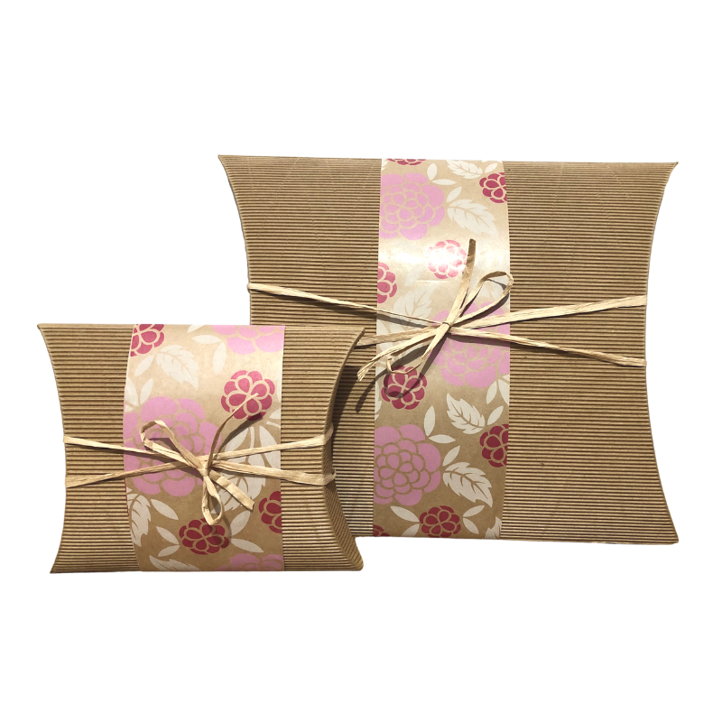 Small Bio Burial Urn Roses made from recycled cardboard with floral wrap and twine bow. Eco-friendly urn for ashes, ideal for green burials.