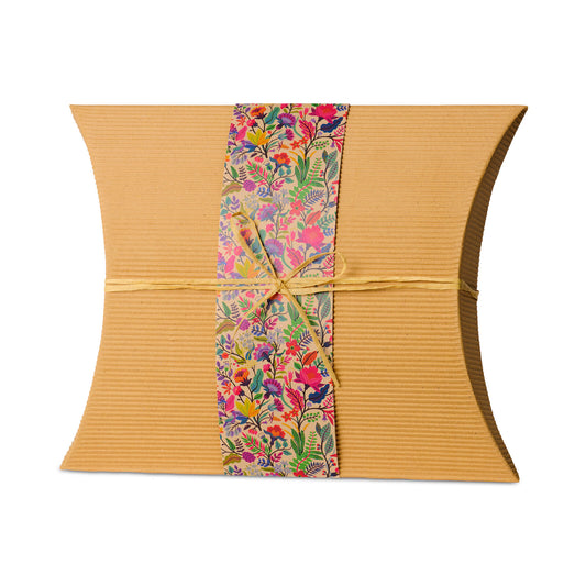 Bio Burial Urn Wilds Large made from eco-friendly cardboard with a floral band and twine, ideal for ground burial of cremation ashes.