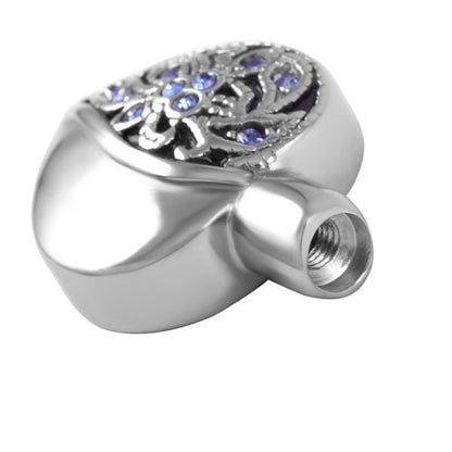 Close-up of Bluestone Heart pendant showing threaded opening for ashes, crafted in stainless steel with embedded blue crystals.