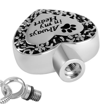 Close-up of stainless steel Engraved Pet Heart Pendant showing secure screw opening for storing pet ashes, perfect for remembrance jewelry.