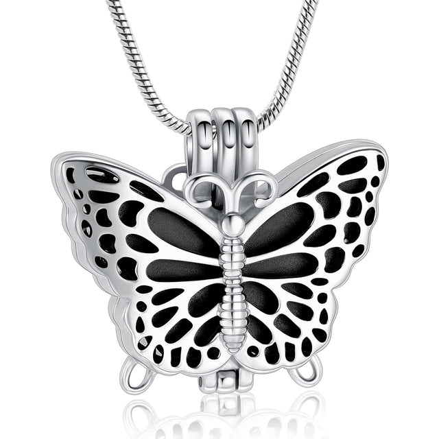 Butterfly Urn Pendant Black - Stainless Steel Necklace with intricate cutout wings and black enamel center, ideal for memorial keepsakes.