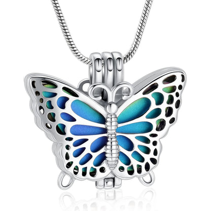 Butterfly Urn Pendant Rainbow in silver-tone stainless steel with vibrant blue and green enamel wings, designed as a cremation ash holder necklace.
