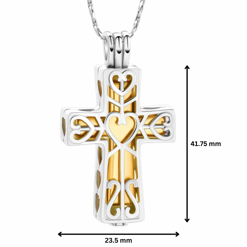 Silver gold cross urn pendant with heart motif, measuring 41.75mm x 23.5mm. Stainless steel memorial keepsake for ashes, includes accessories.