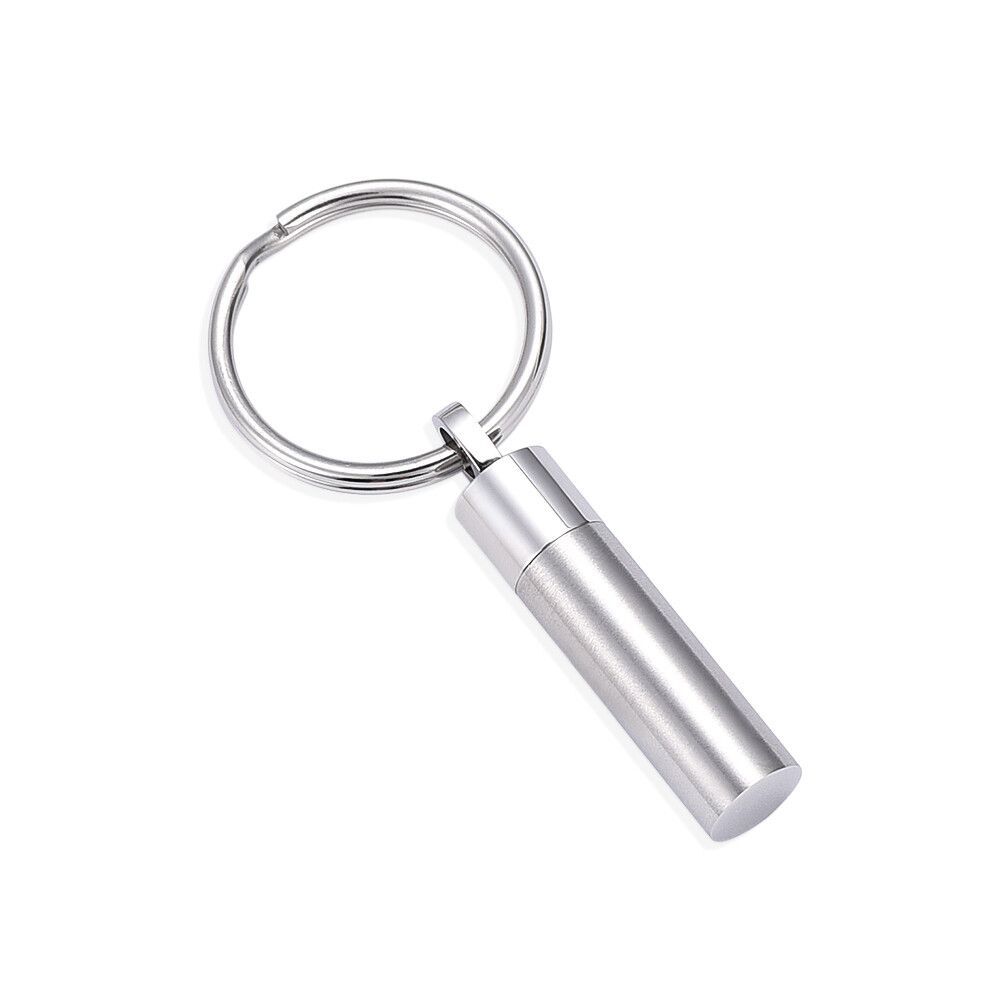 Silver tone cylinder keychain made of stainless steel with a sleek, minimalist design. Ideal for holding ashes securely with a screw-top bail.