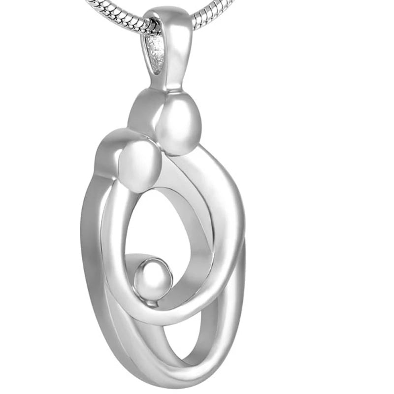 Loving Embrace Pendant - Ash Jewelry | Stainless Steel features a modern abstract design of two adults embracing a child. Ideal for memorial keepsakes.