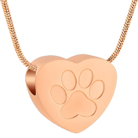 Paw Print Rose Gold Pendant in heart shape, crafted from stainless steel with engraved paw design. Includes velvet bag and satin cord for gifting.