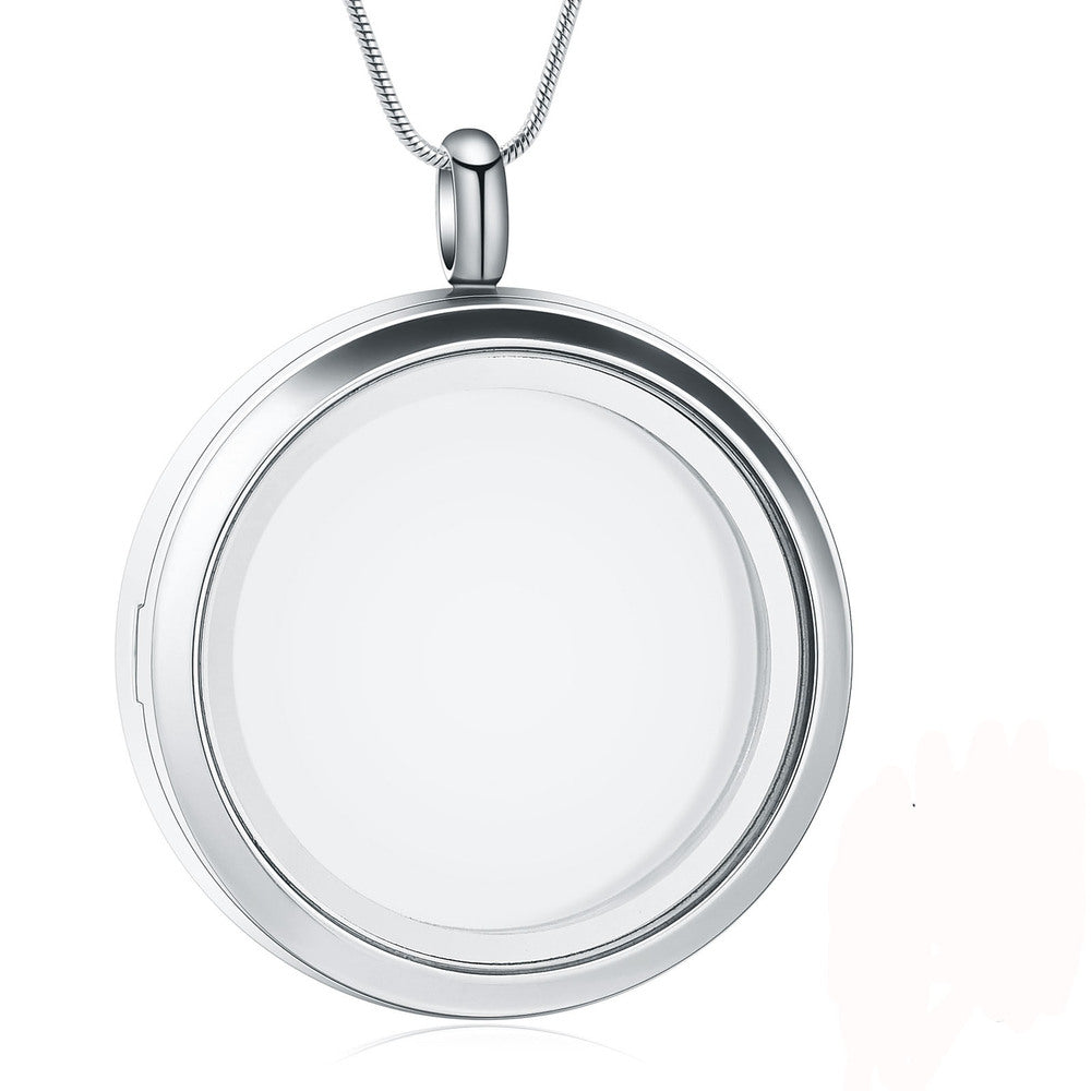 Stainless steel photo locket pendant with clear glass front and magnetic clasp, ideal for storing ashes or small keepsakes. Includes chain for wearing.