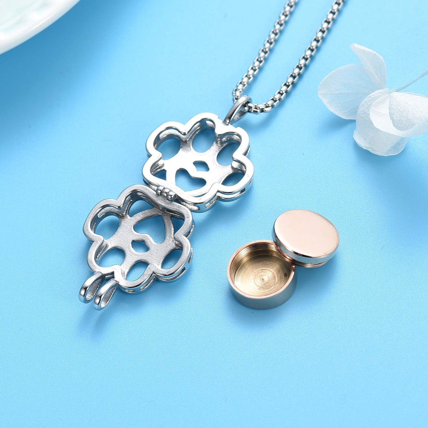 Open Paw Print Urn Pendant Rose Gold Tone showing removable rose gold urn container and stainless steel locket, ideal for pet memorial ashes.