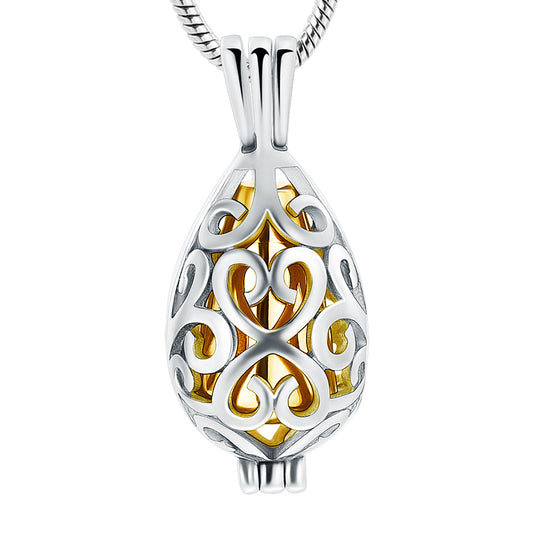 Gold Tear Drop Urn Pendant in stainless steel with intricate silver filigree design, ideal for ash storage keepsake jewelry.