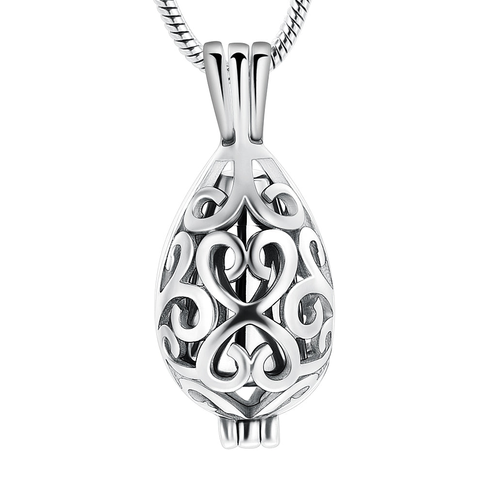 Silver urn pendant in teardrop shape with intricate scroll design, crafted from stainless steel. Ideal keepsake necklace for ashes or memorial use.