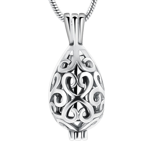 Silver urn pendant in teardrop shape with intricate scroll design, crafted from stainless steel. Ideal keepsake necklace for ashes or memorial use.