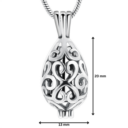 Stainless steel teardrop urn pendant with scrollwork, measuring 20mm by 13mm. Elegant silver memorial necklace for ashes or keepsake storage.
