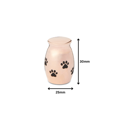 Paw Print Thimble Urn Rose Gold - Keepsake | 30mm Size. Compact 30mm tall urn with 25mm width, rose gold tone and black paw prints for pet remembrance.