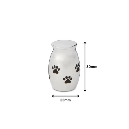 30mm Paw Print Urn Silver Tone - Stainless steel pet urn with black paw prints, shown with 25mm width and 30mm height dimensions.