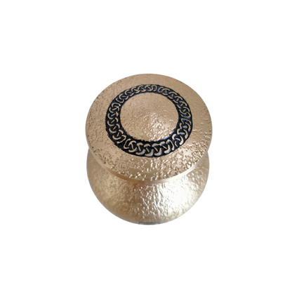 Hammered Gold Cross Urn Keepsake - Memorial | Durable, Elegant. Top view of gold urn lid featuring intricate black circular pattern, crafted for lasting remembrance.