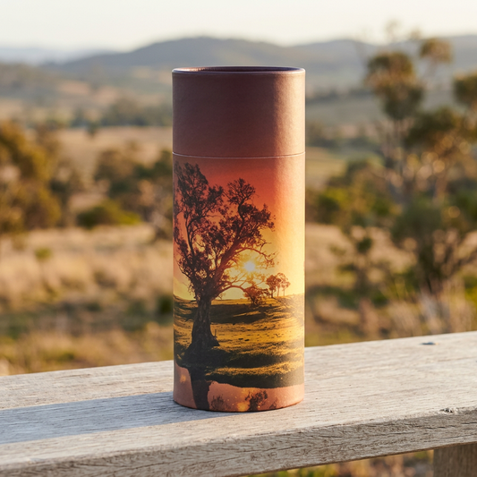 Large Sunset Scattering Urn overlooking softly lit countryside